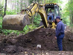Groton Town crew operates excavator