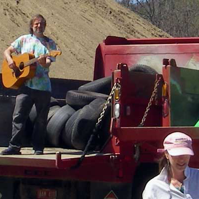 guitar player on garbage truck