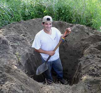 man digging with a smile