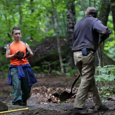 two people work on trail