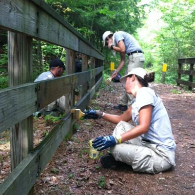 NCCC crew stains fence