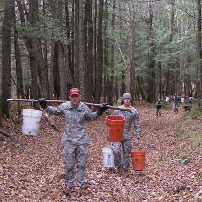 volunteers carry gravel